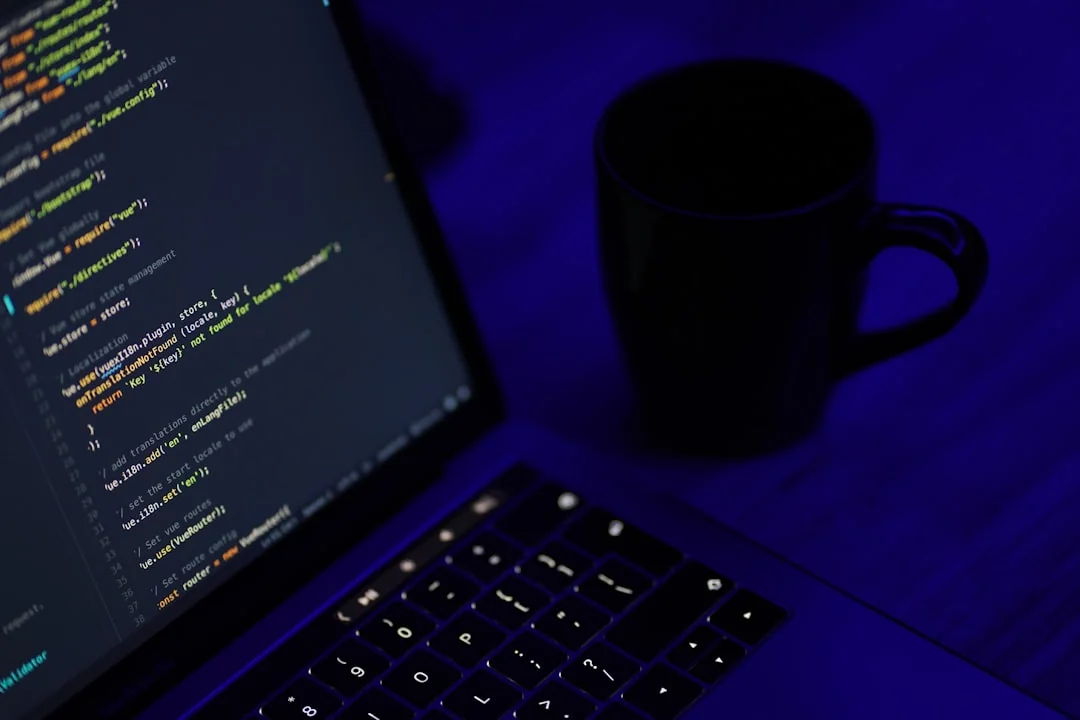 A modern workspace featuring dual computer monitors displaying web design projects, emphasizing technology and productivity.